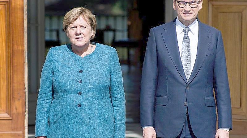 Noch-Bundeskanzlerin Angela Merkel und der polnische Ministerpräsidenten Mateusz Morawiecki. Foto: Attila Husejnow/SOPA Images via ZUMA Press Wire/dpa