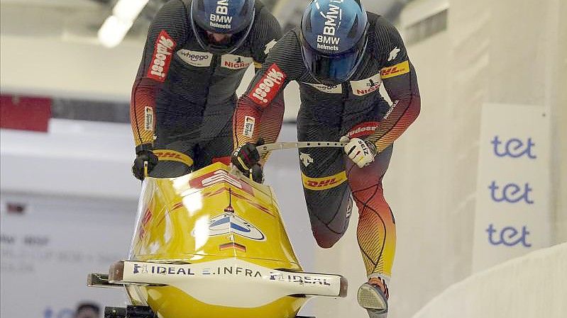 Francesco Friedrich und Thorsten Margis gewannen in Sigulda. Foto: Roman Koksarov/AP/dpa