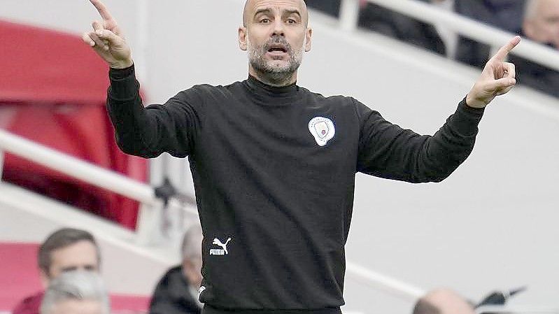 Manchester Citys Coach Pep Guardiola hat sich mit dem Coronavirus infiziert. Foto: Matt Dunham/AP/dpa