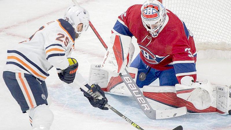 Für Leon Draisaitl (l) lief es gegen die Montreal Canadiens besonders gut. Foto: Graham Hughes/The Canadian Press via AP/dpa