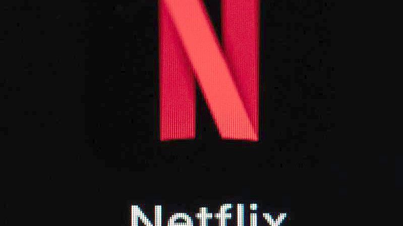 Die Netflix-App auf dem Display eines iPhone SE. Die Aktie des Konzerns ist abgerutscht. Foto: Silas Stein/dpa