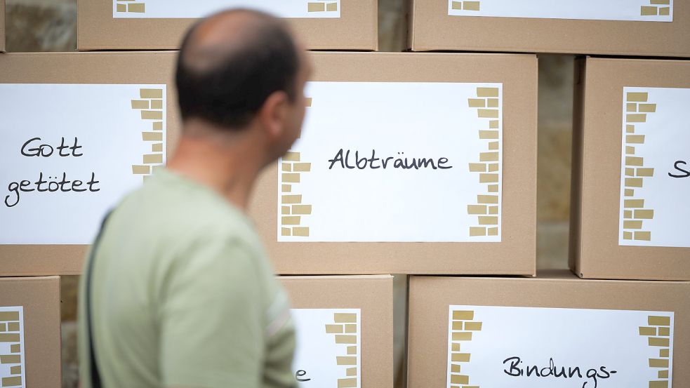 Mahnwache am Vorabend des Ökumenischen Kirchentages: In Osnabrück ging es auch um das Thema Missbrauch. Foto: Friso Gentsch/dpa
