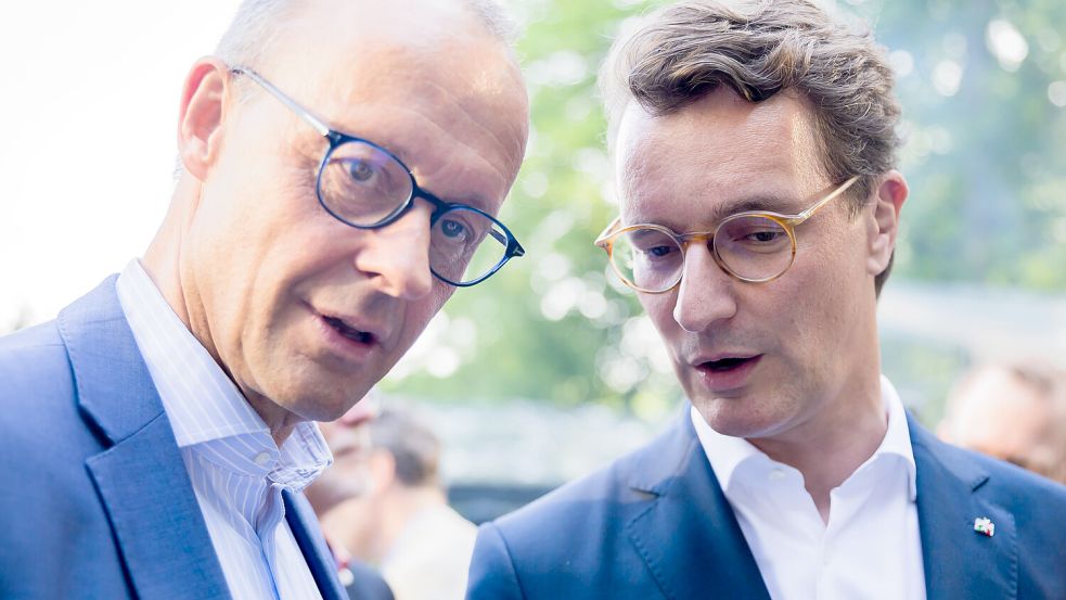 Parteikollegen und potenzielle Konkurrenten? Friedrich Merz (l) und Hendrik Wüst. Foto: dpa/Christoph Soeder