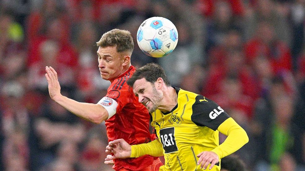 Joshua Kimmich (l) hat eine Forderung an das Bayern-Spiel. Foto: Tom Weller/dpa