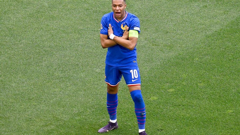 Frankreichs Matchwinner Kylian Mbappé in seiner typischen Jubelpose. Foto: Marijan Murat/dpa