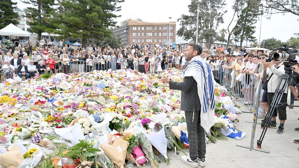 In Australien gedenken die Menschen der Opfer des Anschlags. Foto: Mick Tsikas