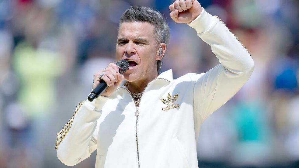 Robbie Williams überraschte seine Fans drei Wochen früher mit seinem neuen Album. (Archivbild) Foto: Sven Hoppe