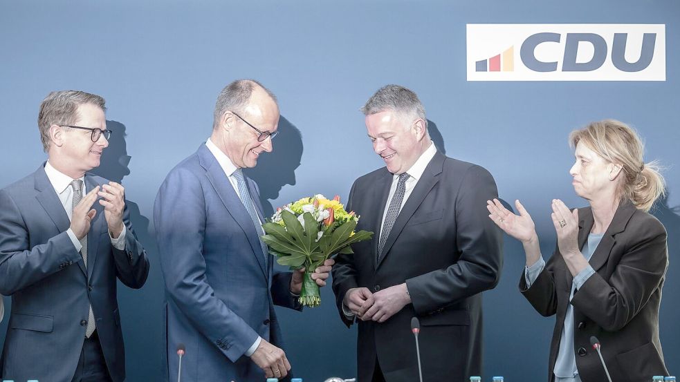 Bei der CDU wurde der Wahlsieg gefeiert – aber nicht zu laut. Foto: Michael Kappeler/dpa